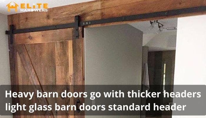Heavy barn doors go with thicker headers light glass barn doors standard header